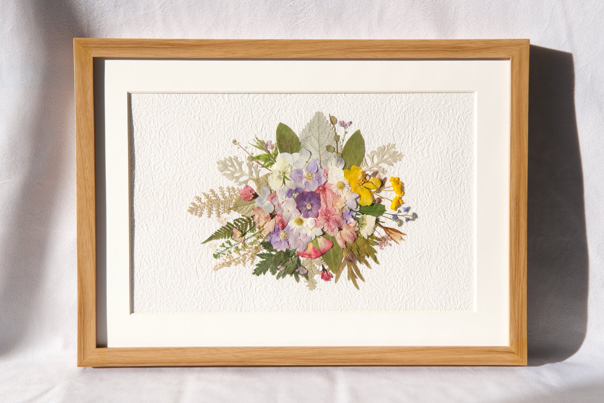 wreath shaped pressed flower frame art